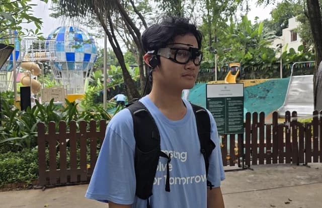 A runner wearing the RunSight glasses on a track